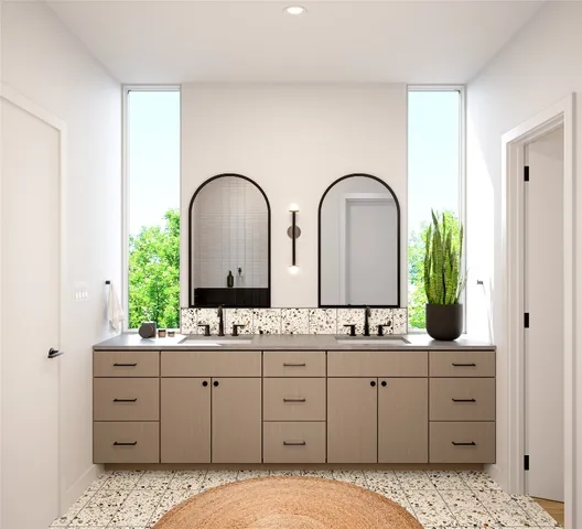 a bathroom with a double vanity sink and mirror