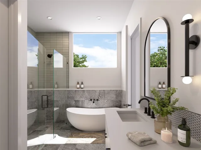 a bathroom with a bathtub sink and mirror