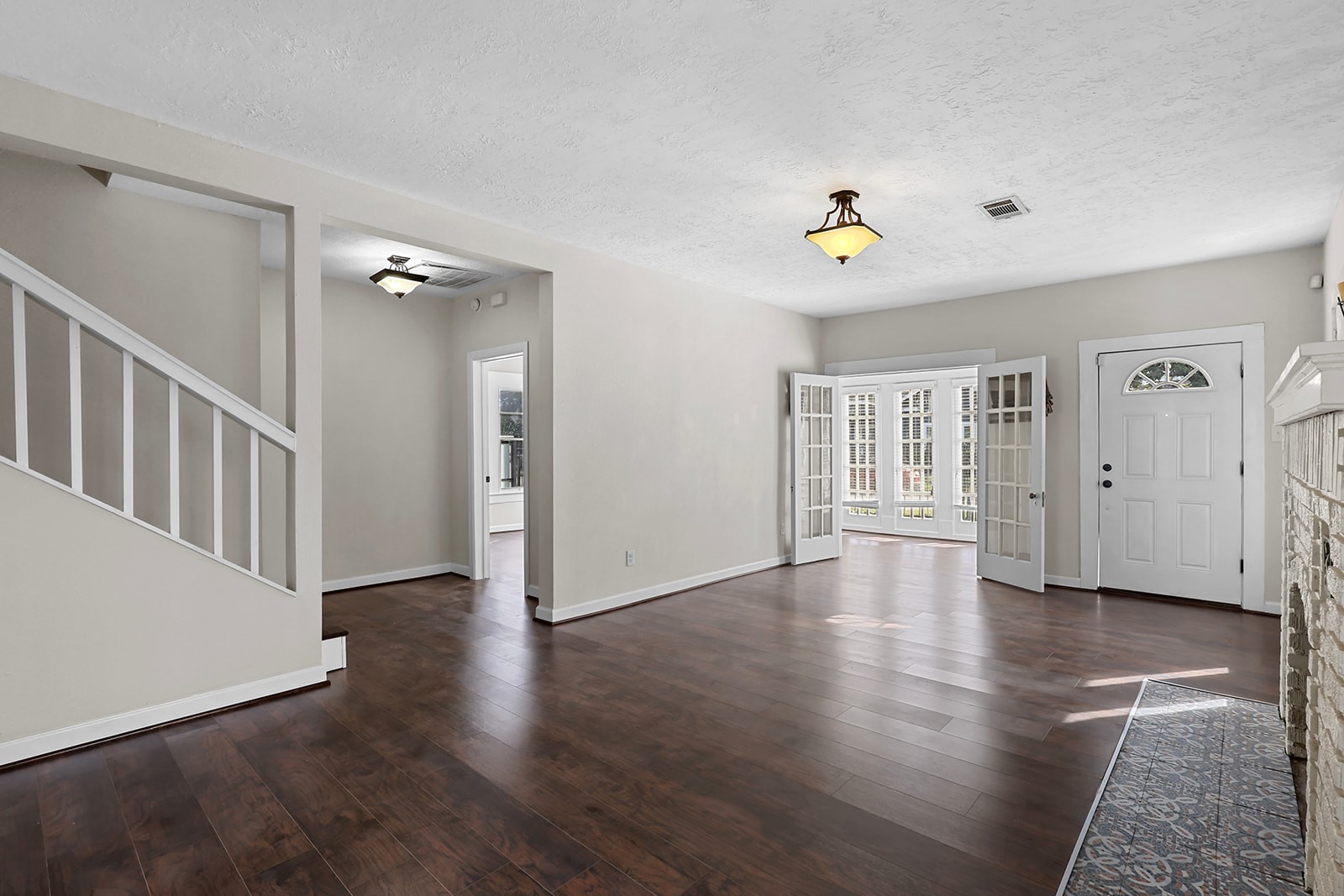 5401 North Capitol Street Houston, TX 77011 - Photo 3 of 34 wooden floor in an empty room with a window