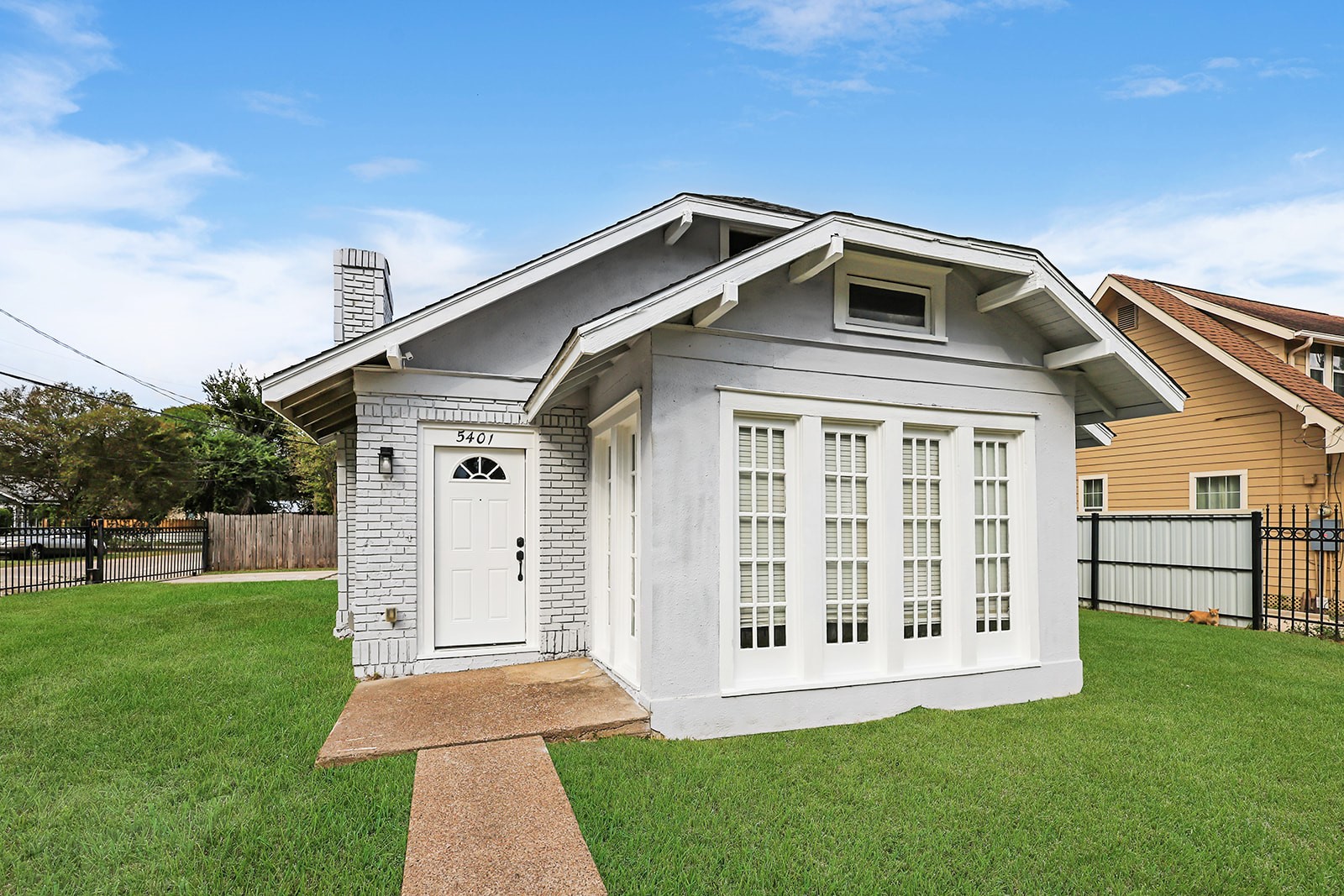5401 North Capitol Street Houston, TX 77011 - Photo 7 of 34 a front view of a house with a yard