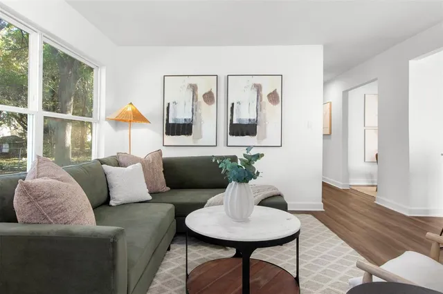 a living room with furniture and a window