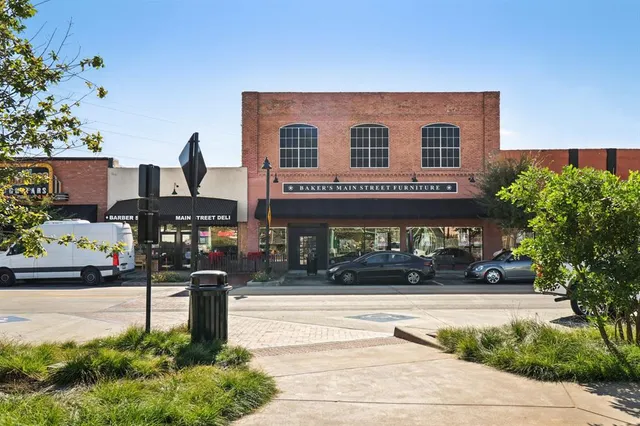 a front view of a building with parking