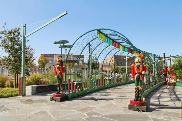 a view of a park with tall trees