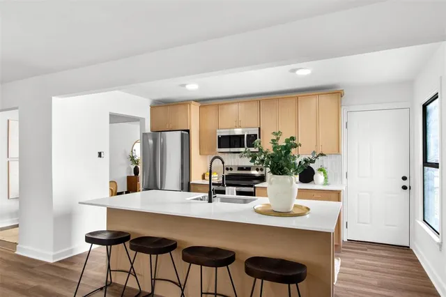 a kitchen with a table and chairs in it