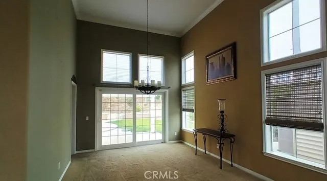 a view of entryway and hall with windows