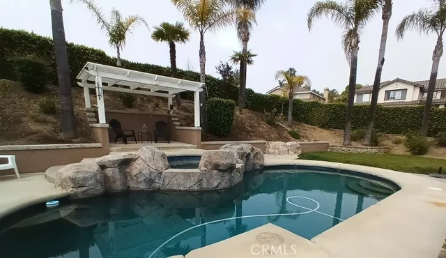 a view of a swimming pool with a patio