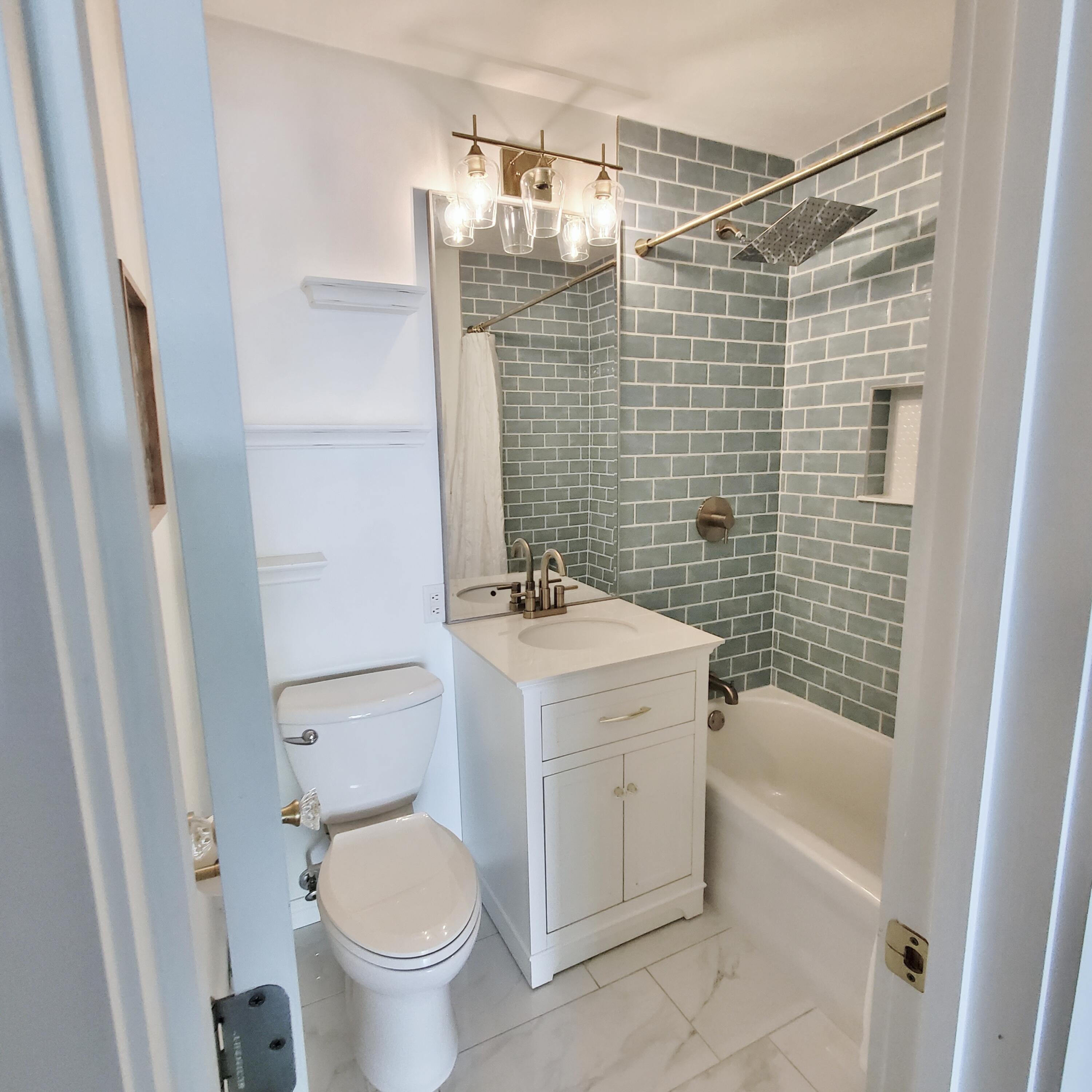 514 Birch Tree Lane Michigan City, IN 46360 - Photo 15 of 23 a bathroom with a sink toilet and shower