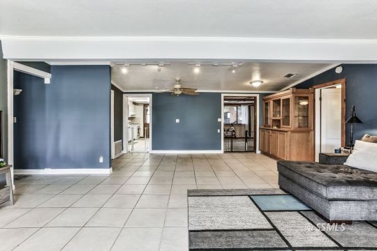 541 South Allen Street Ridgecrest, CA 93555 - Photo 5 of 41 a living room with stainless steel appliances kitchen island granite countertop furniture a rug and white cabinets