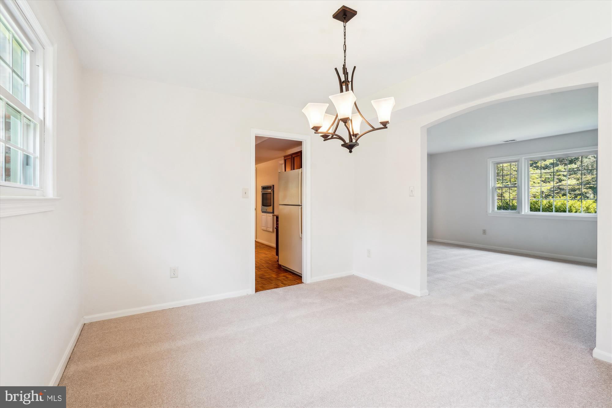 12109 Stirrup Road Reston, VA 20191 - Photo 12 of 52 a view of a livingroom with a chandelier