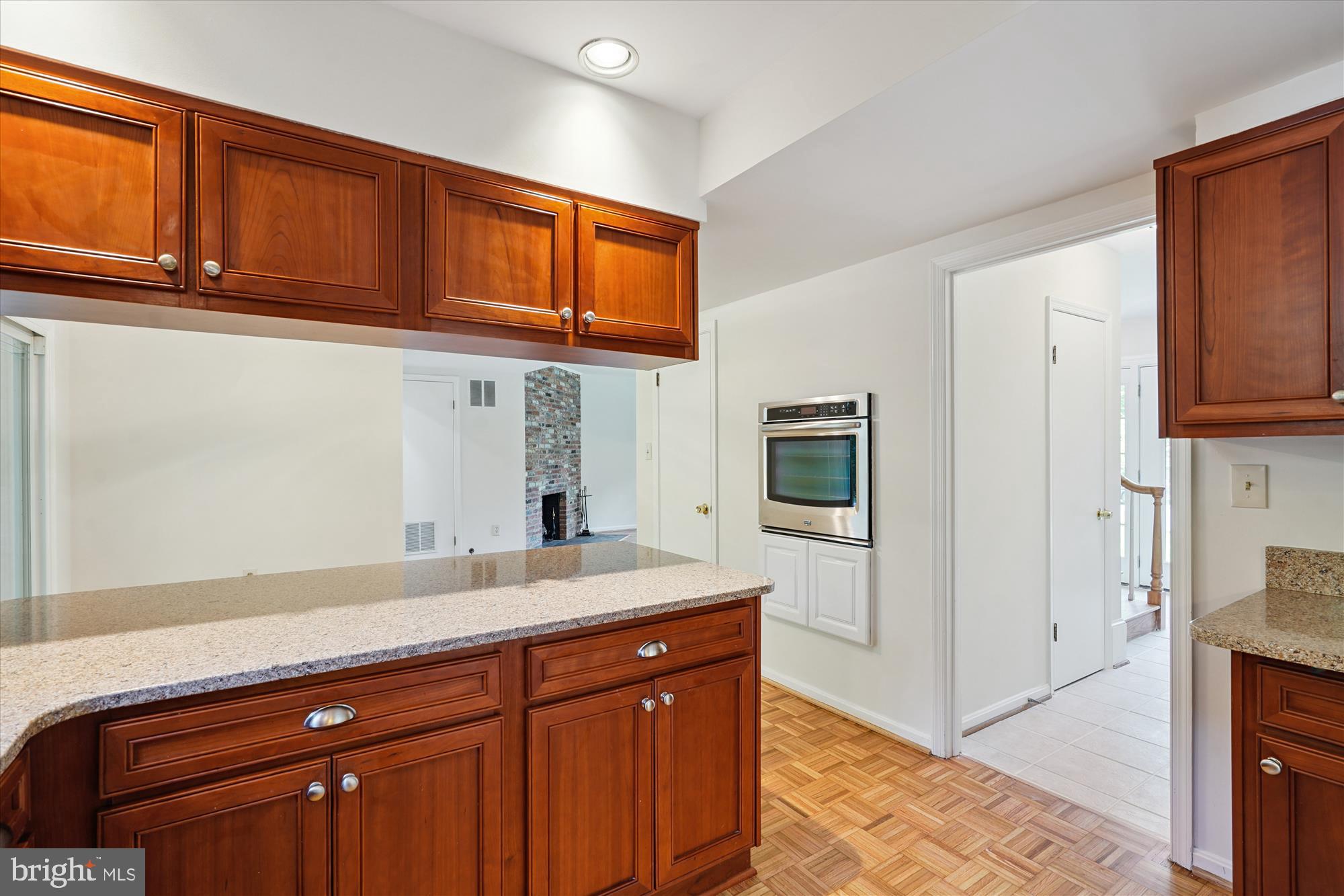 12109 Stirrup Road Reston, VA 20191 - Photo 14 of 52 a kitchen with stainless steel appliances granite countertop a refrigerator and cabinets