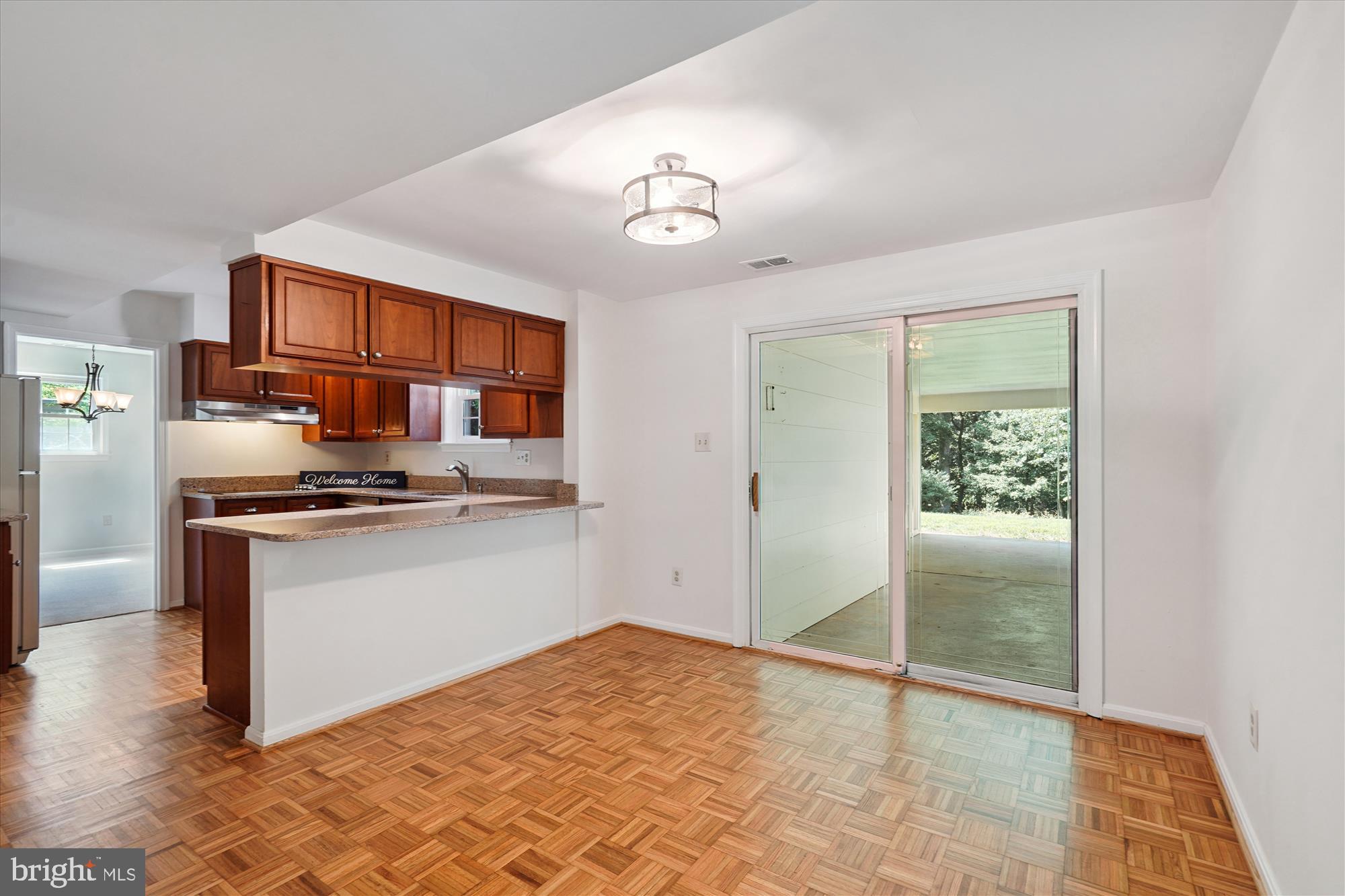 12109 Stirrup Road Reston, VA 20191 - Photo 15 of 52 a kitchen with stainless steel appliances granite countertop a refrigerator stove and sink