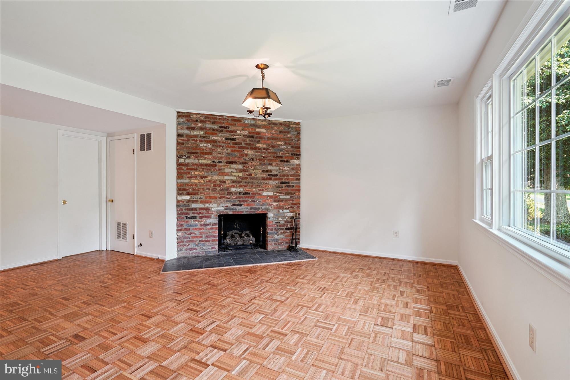 12109 Stirrup Road Reston, VA 20191 - Photo 18 of 52 a view of empty room with window and fireplace
