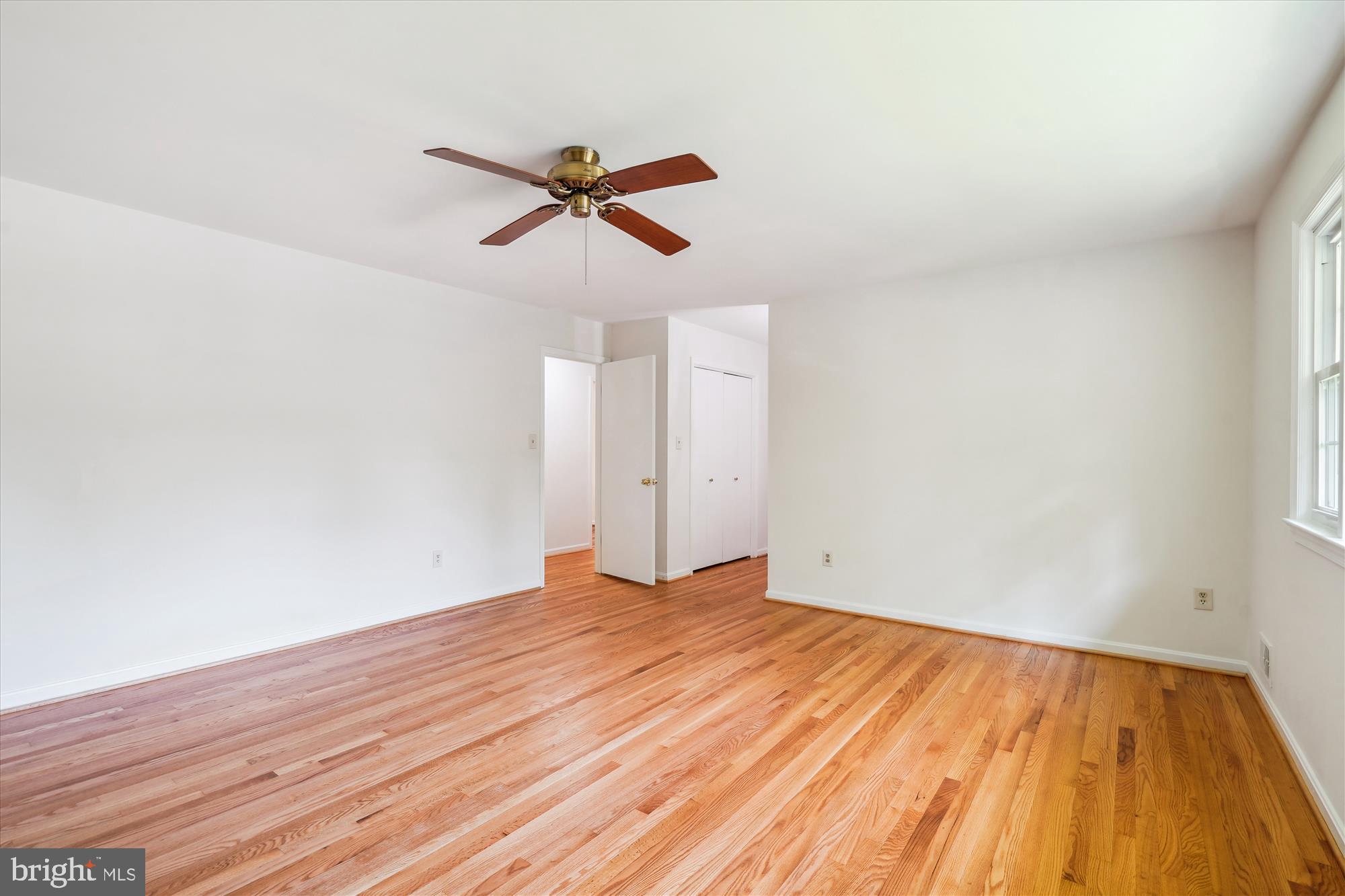 12109 Stirrup Road Reston, VA 20191 - Photo 24 of 52 a view of empty room with wooden floor and ceiling fan