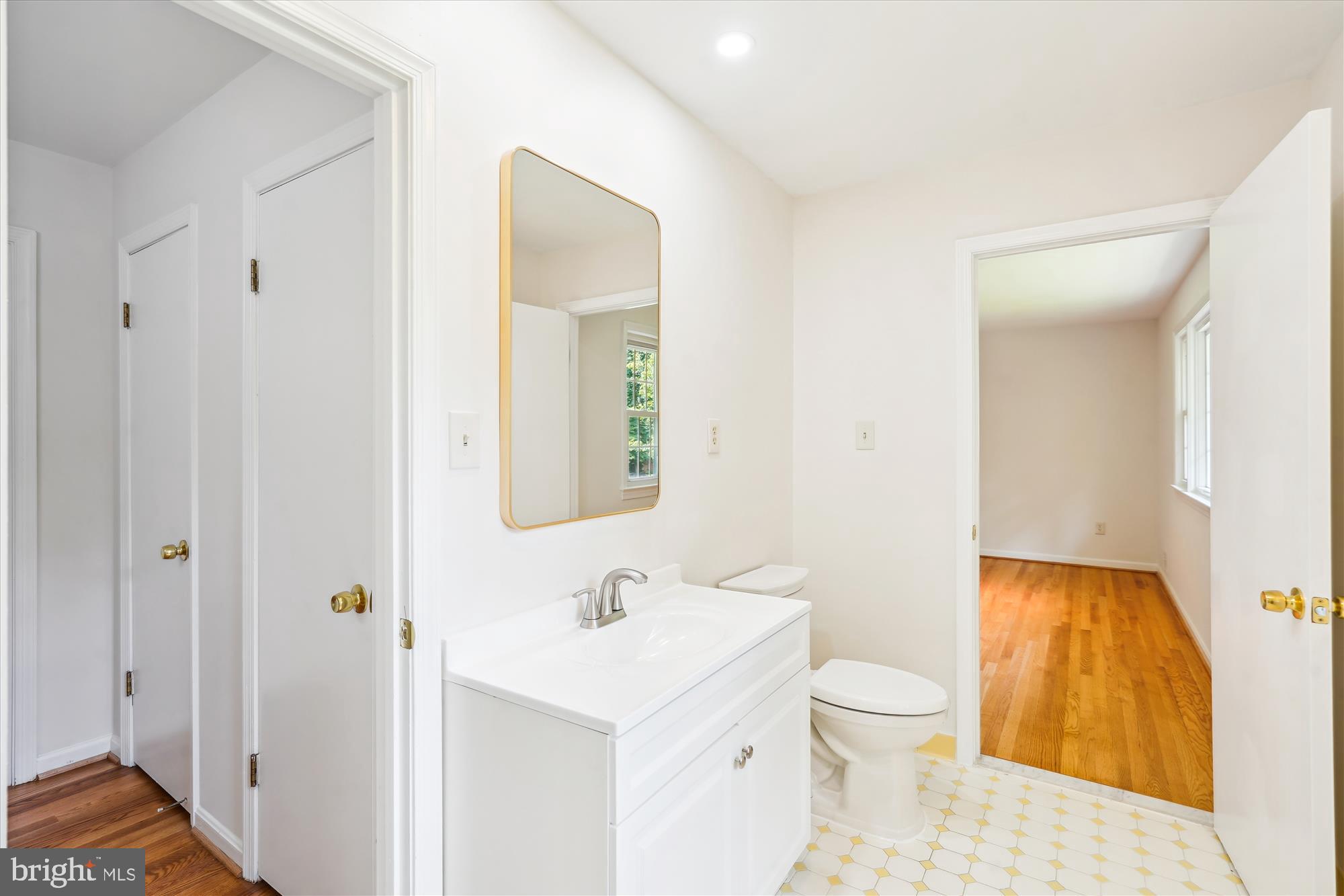 12109 Stirrup Road Reston, VA 20191 - Photo 28 of 52 a bathroom with a toilet a sink and a mirror
