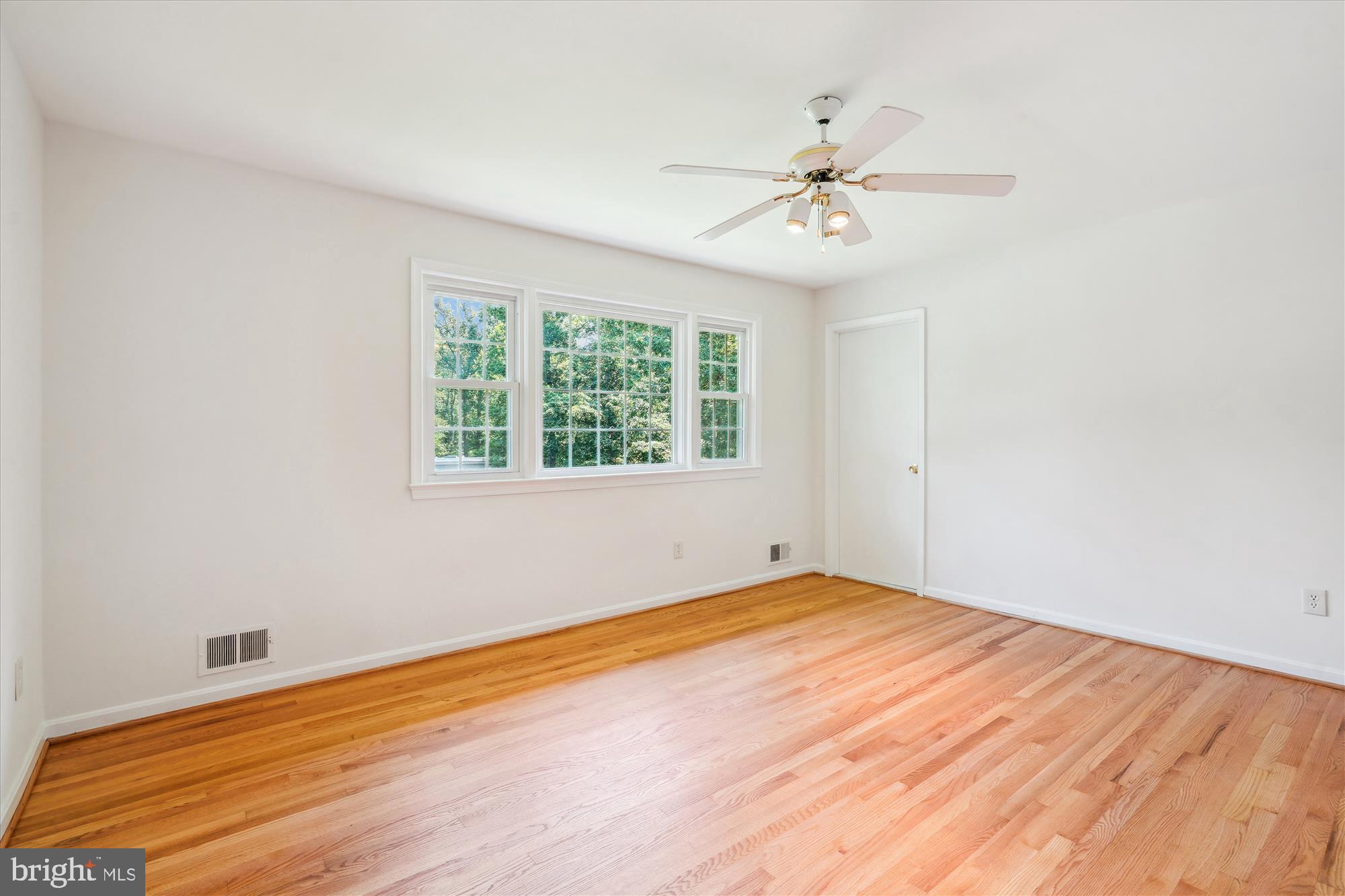 12109 Stirrup Road Reston, VA 20191 - Photo 29 of 52 wooden floor in an empty room with a window