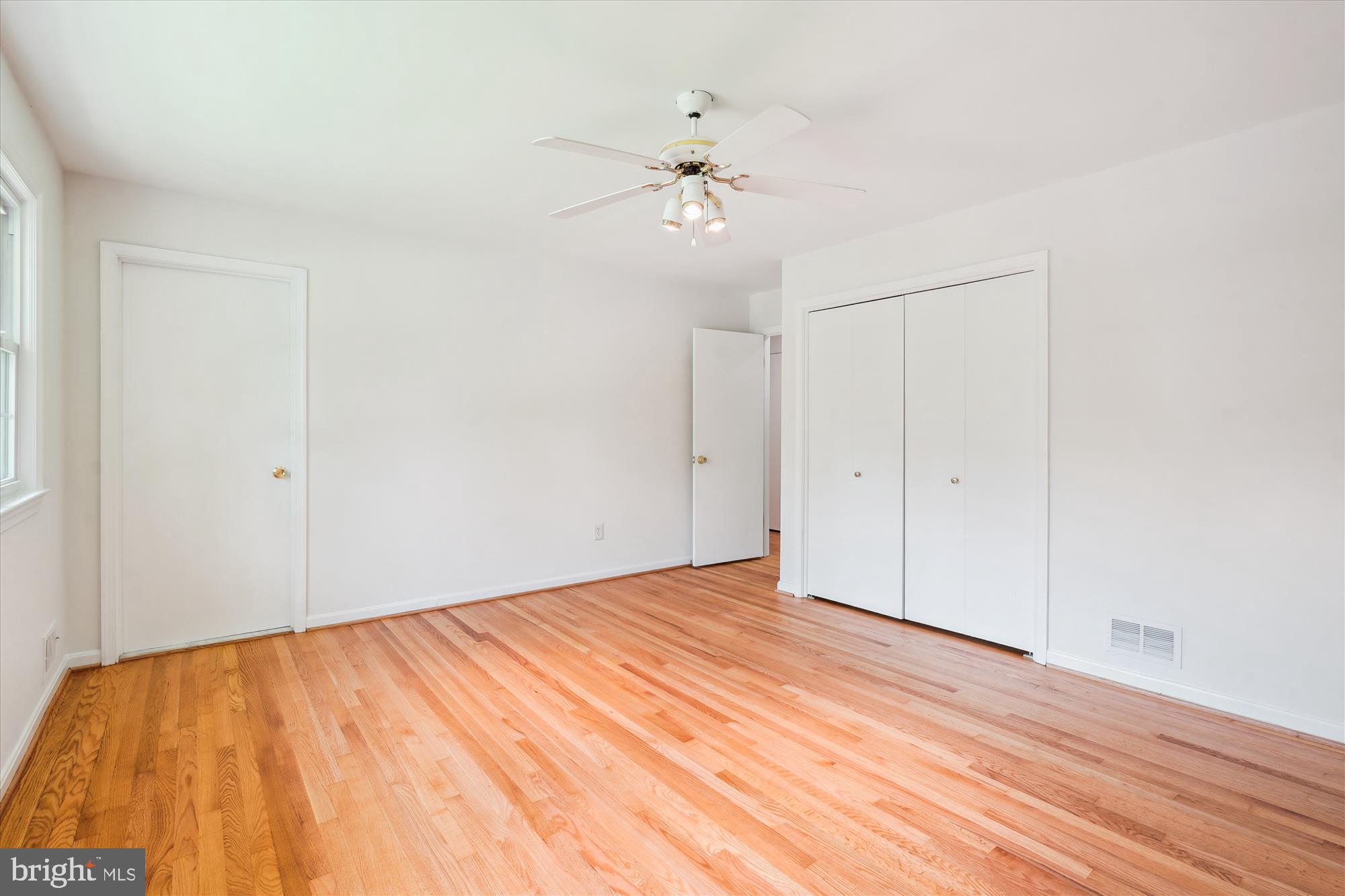 12109 Stirrup Road Reston, VA 20191 - Photo 30 of 52 a view of empty room with wooden floor