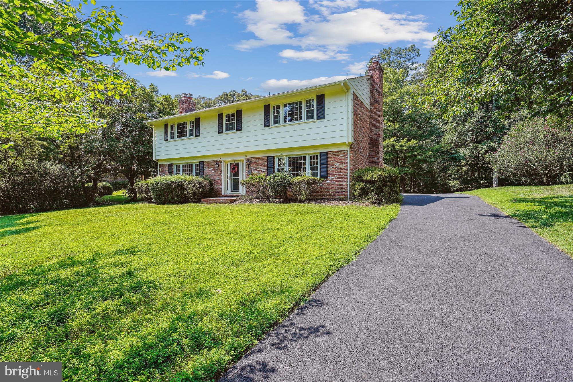 12109 Stirrup Road Reston, VA 20191 - Photo 3 of 52 a view of house that has a yard
