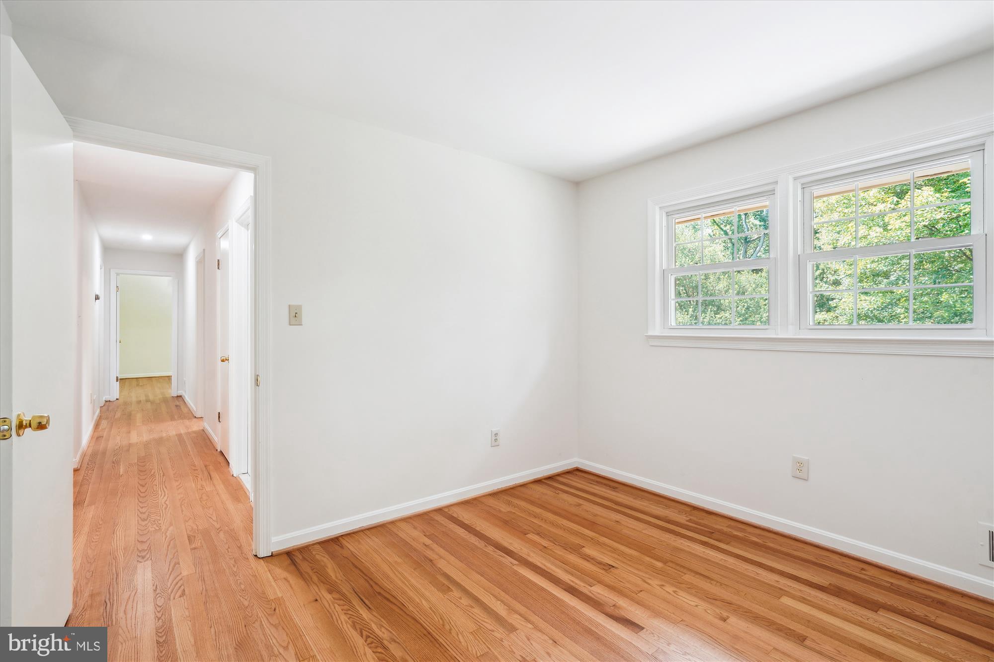 12109 Stirrup Road Reston, VA 20191 - Photo 35 of 52 wooden floor in an empty room with a window