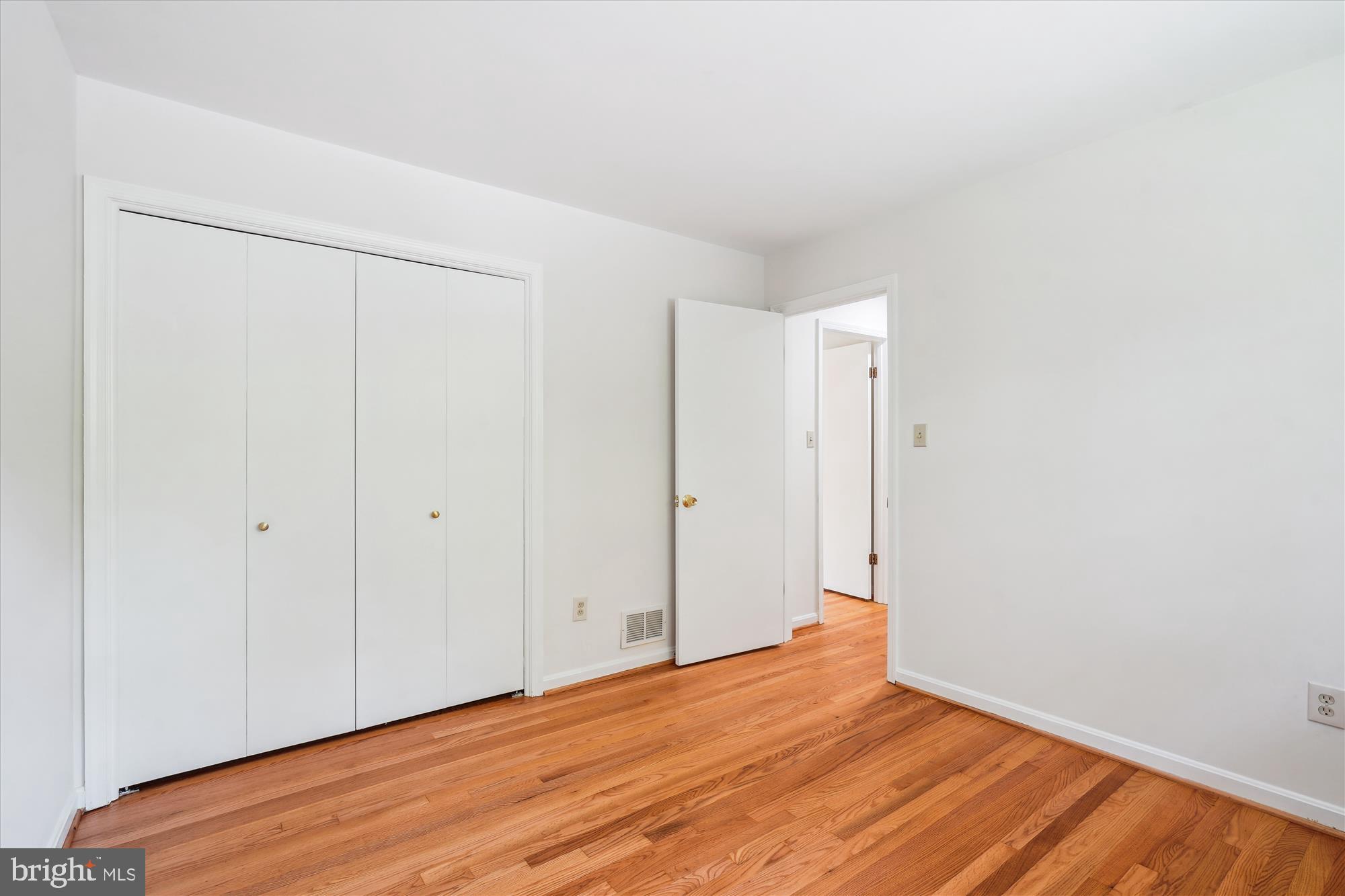12109 Stirrup Road Reston, VA 20191 - Photo 36 of 52 a view of an empty room with wooden floor