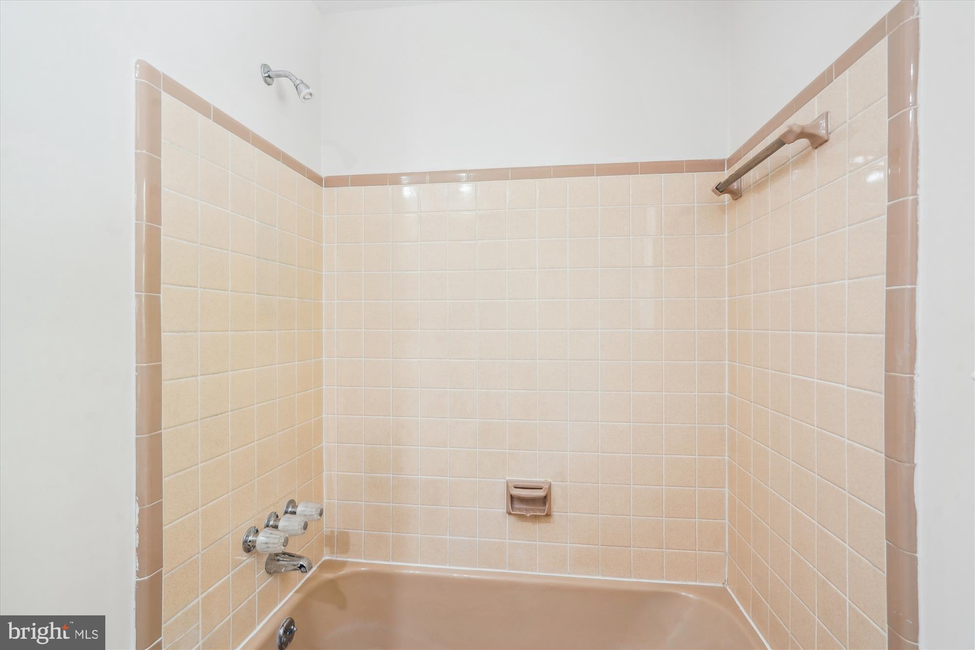 12109 Stirrup Road Reston, VA 20191 - Photo 40 of 52 a bathroom with a shower and a bath tub