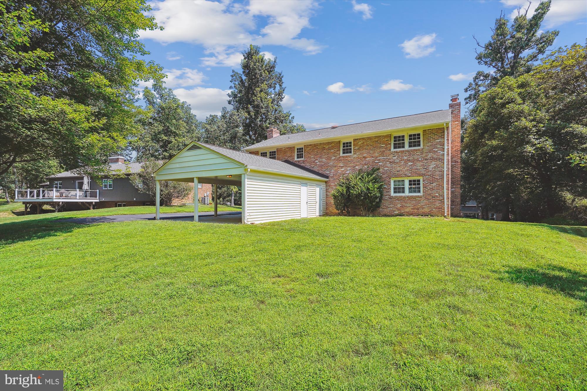 12109 Stirrup Road Reston, VA 20191 - Photo 44 of 52 a front view of house with yard and green space
