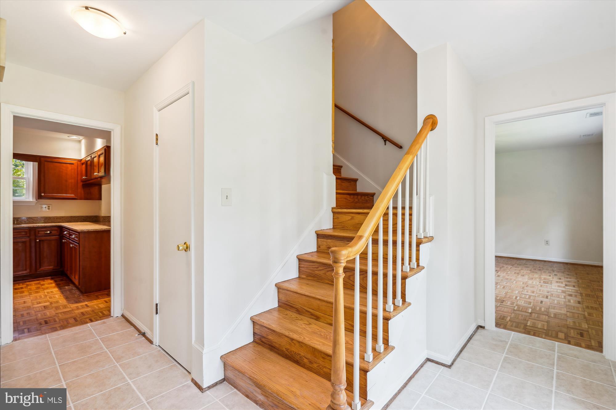 12109 Stirrup Road Reston, VA 20191 - Photo 6 of 52 a view of a hallway with staircase and utility room