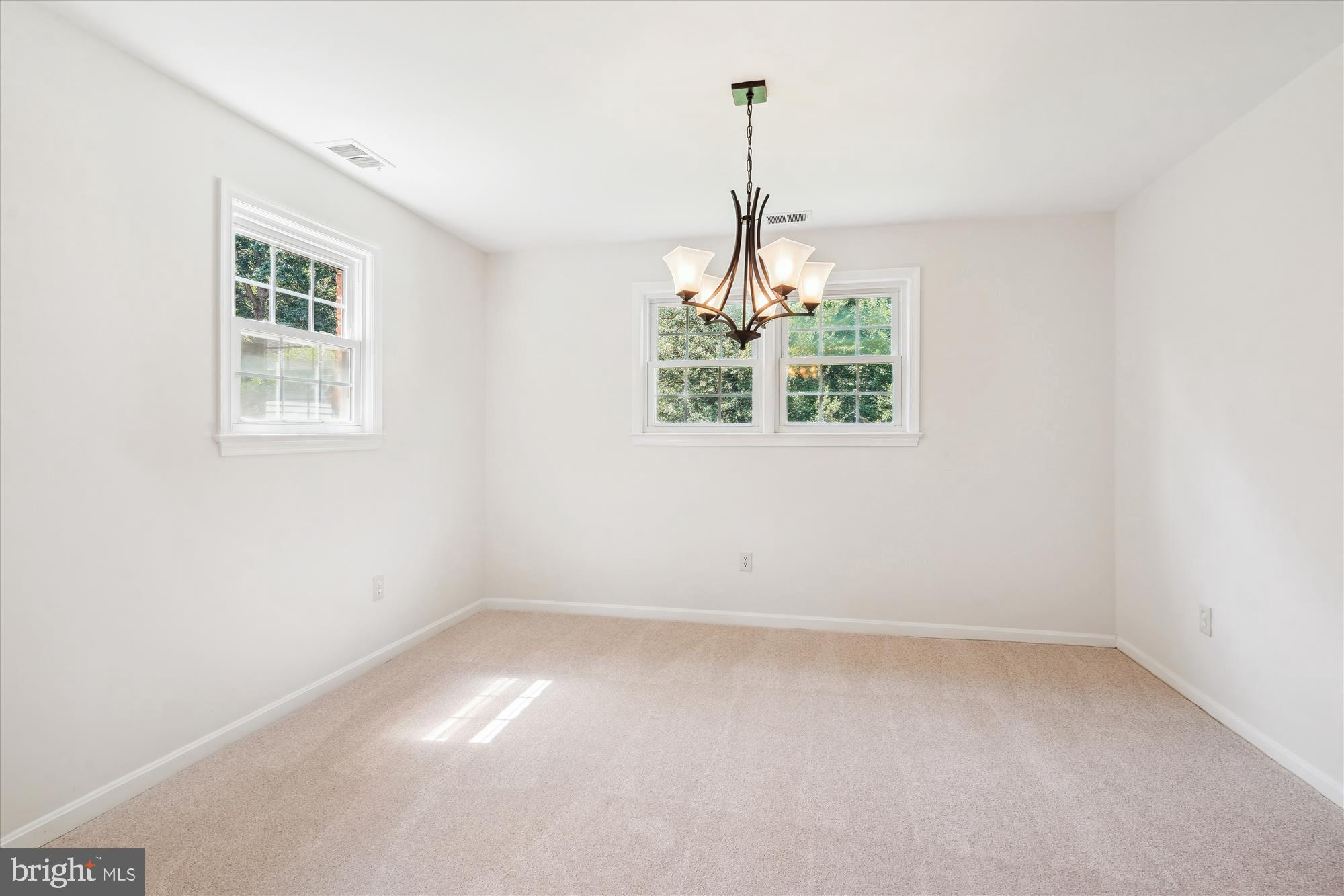 12109 Stirrup Road Reston, VA 20191 - Photo 10 of 52 a view of a room with window and chandelier