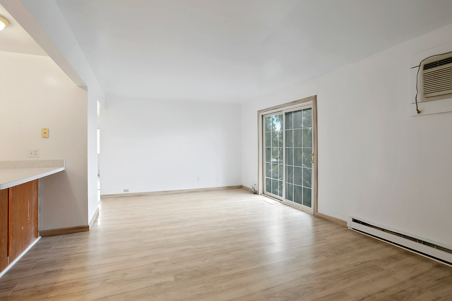 20206 South Frankfort Square Road, Unit F Frankfort, IL 60423 - Photo 4 of 16 a view of an empty room with wooden floor and a window