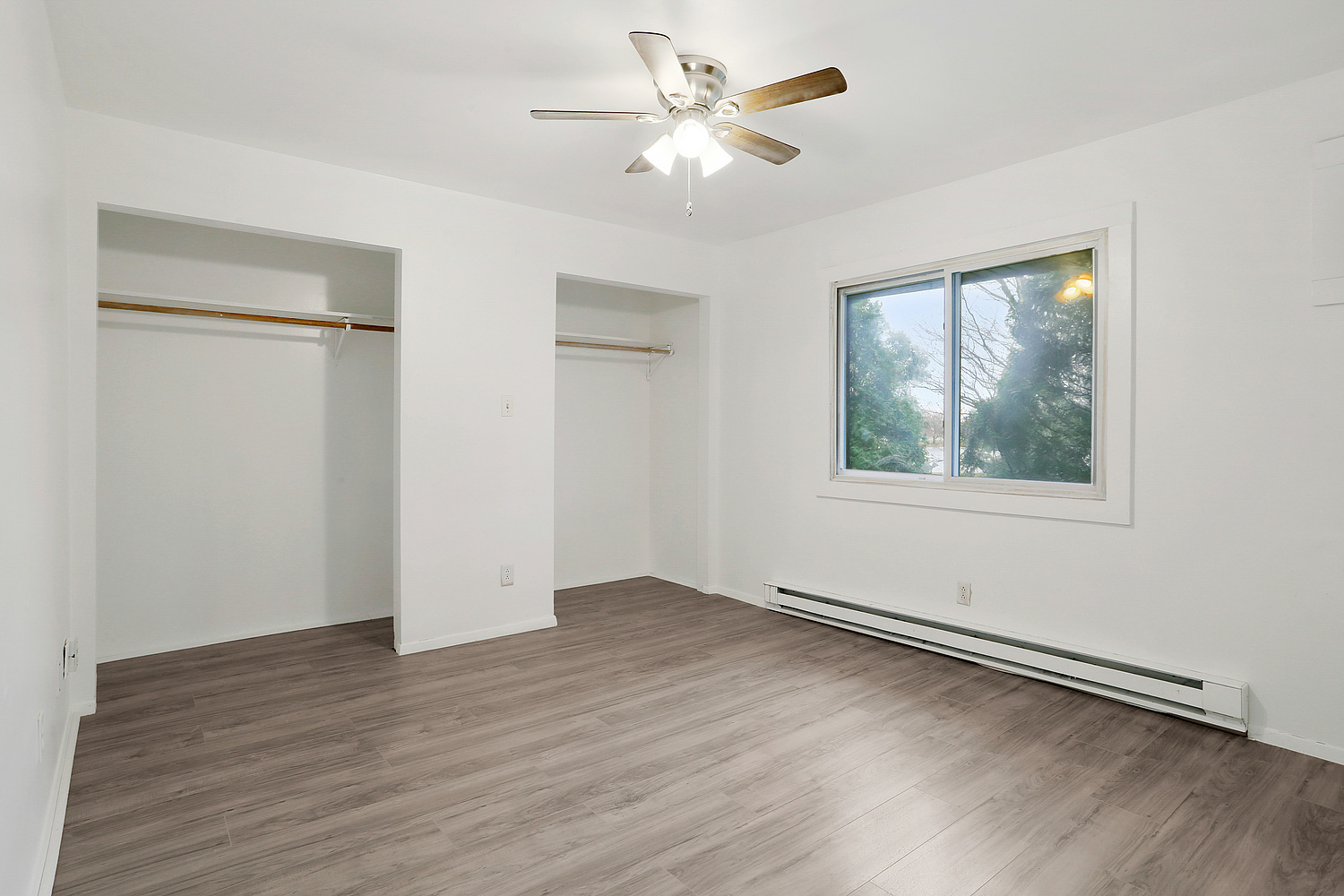 20206 South Frankfort Square Road, Unit F Frankfort, IL 60423 - Photo 10 of 16 a view of an empty room with wooden floor and a window