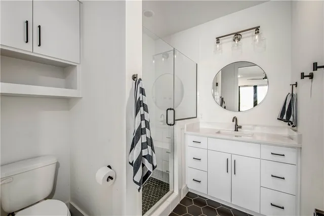 a bedroom with two beds and a large window