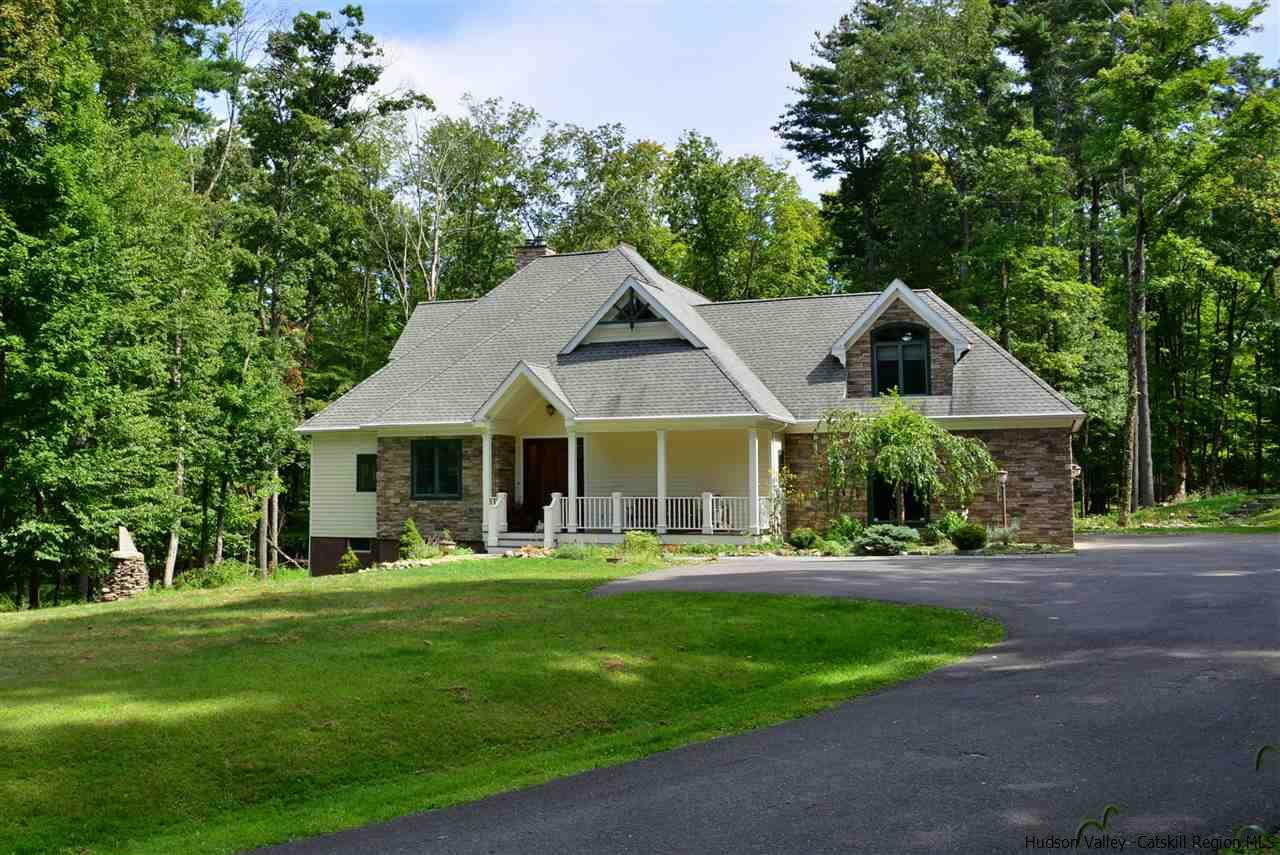 4651 Atwood Road Stone Ridge, NY 12484 - Photo 1 of 31 a front view of a house with a yard and trees