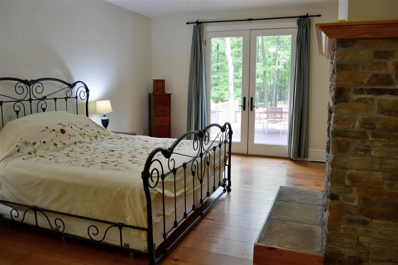 4651 Atwood Road Stone Ridge, NY 12484 - Photo 20 of 31 a bedroom with a bed and a window