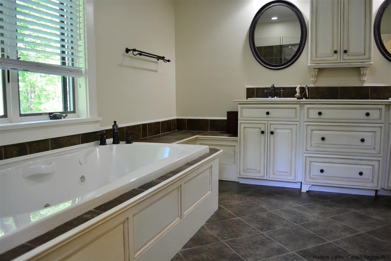 4651 Atwood Road Stone Ridge, NY 12484 - Photo 22 of 31 a bathroom with a sink and a mirror