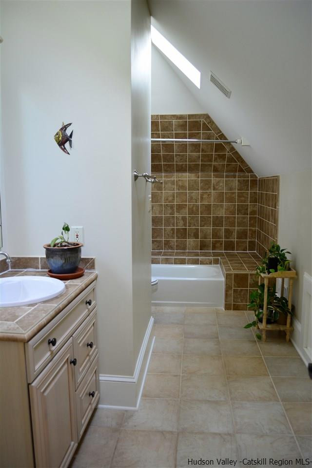 4651 Atwood Road Stone Ridge, NY 12484 - Photo 26 of 31 a bathroom with a sink and a mirror