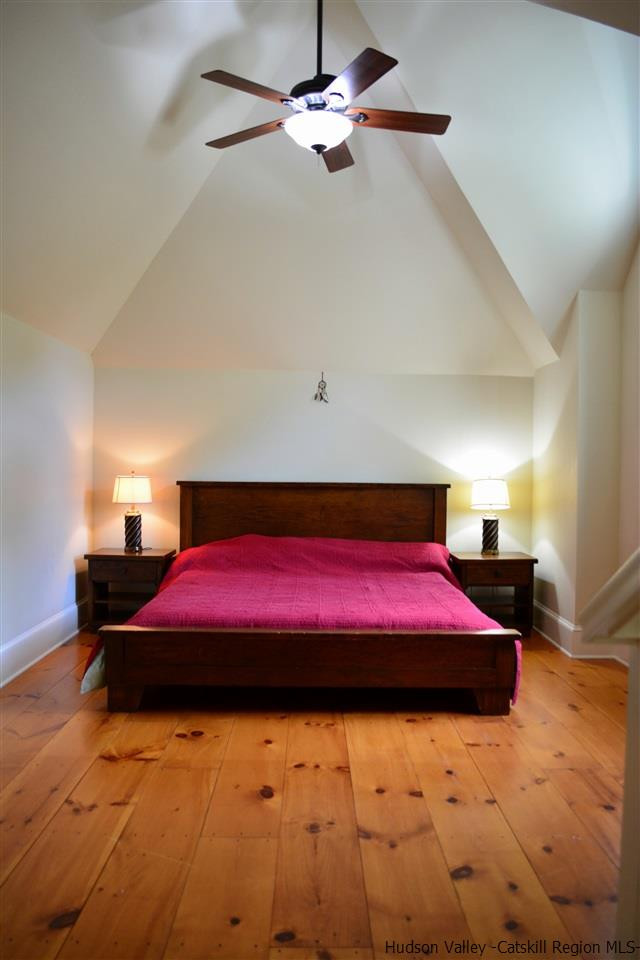 4651 Atwood Road Stone Ridge, NY 12484 - Photo 27 of 31 a bedroom with a bed and a lamp