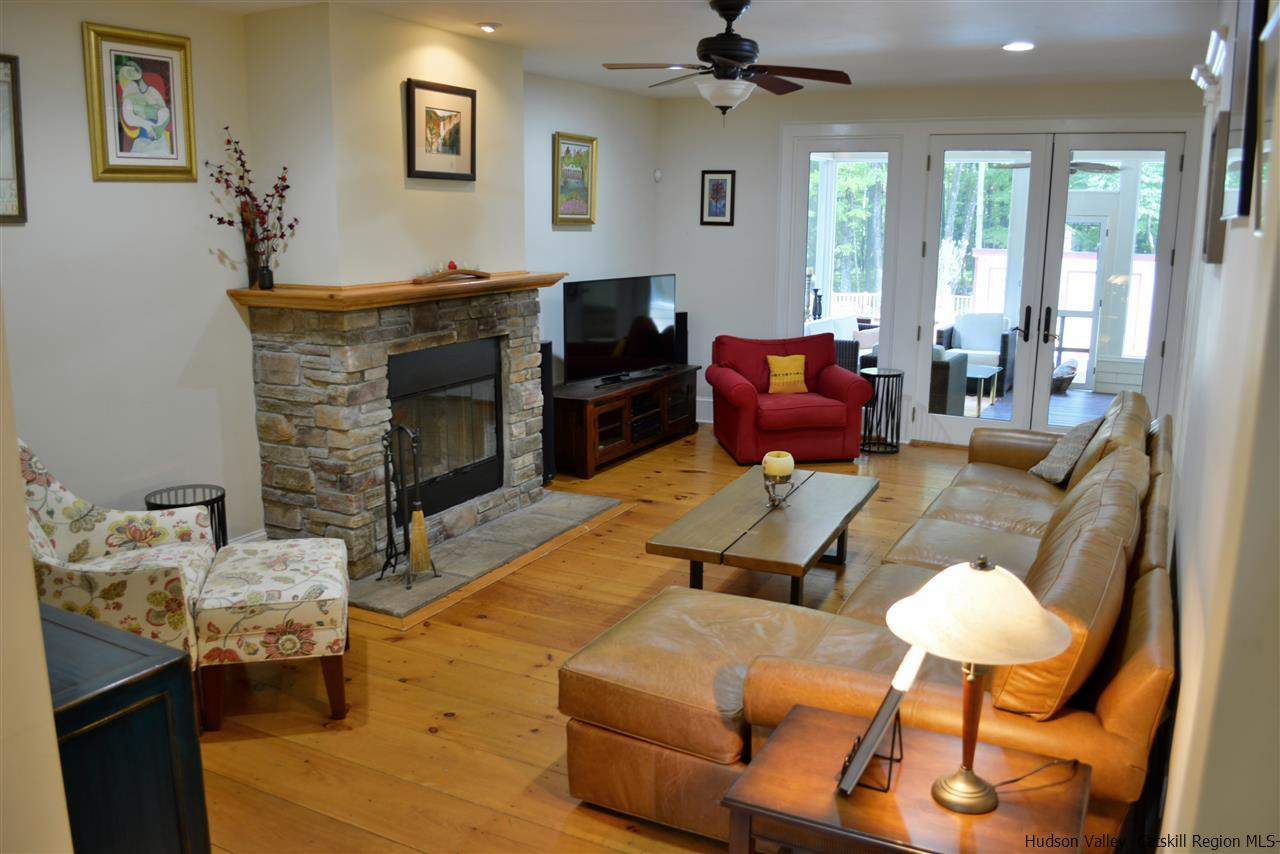 4651 Atwood Road Stone Ridge, NY 12484 - Photo 9 of 31 a living room with furniture and a fireplace