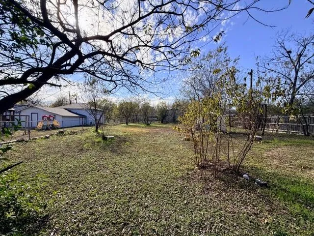 a backyard of a house with lots of green space