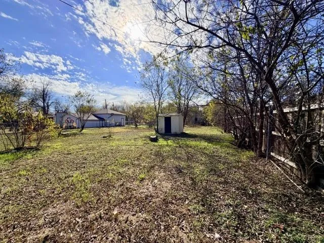 a backyard of a house with lots of green space