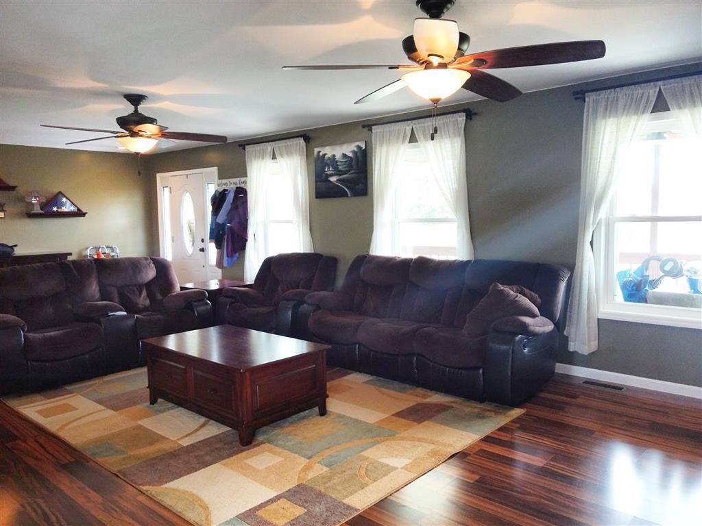 310 Highway 305 Decatur, TN 37322 - Photo 9 of 31 a living room with furniture and a chandelier