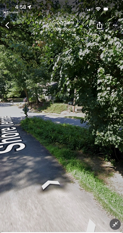 4 Shore Road Wellesley, MA 01760 - Photo 19 of 23 a backyard of a house with yard and outdoor seating