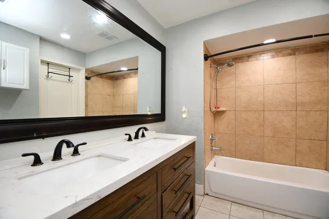 a bathroom with a sink and a bathtub