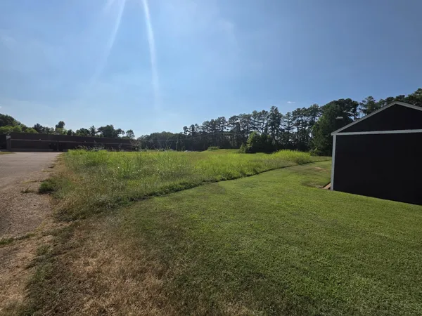 a view of a field with an outdoor space