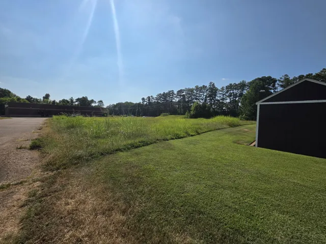 a view of a field with an outdoor space