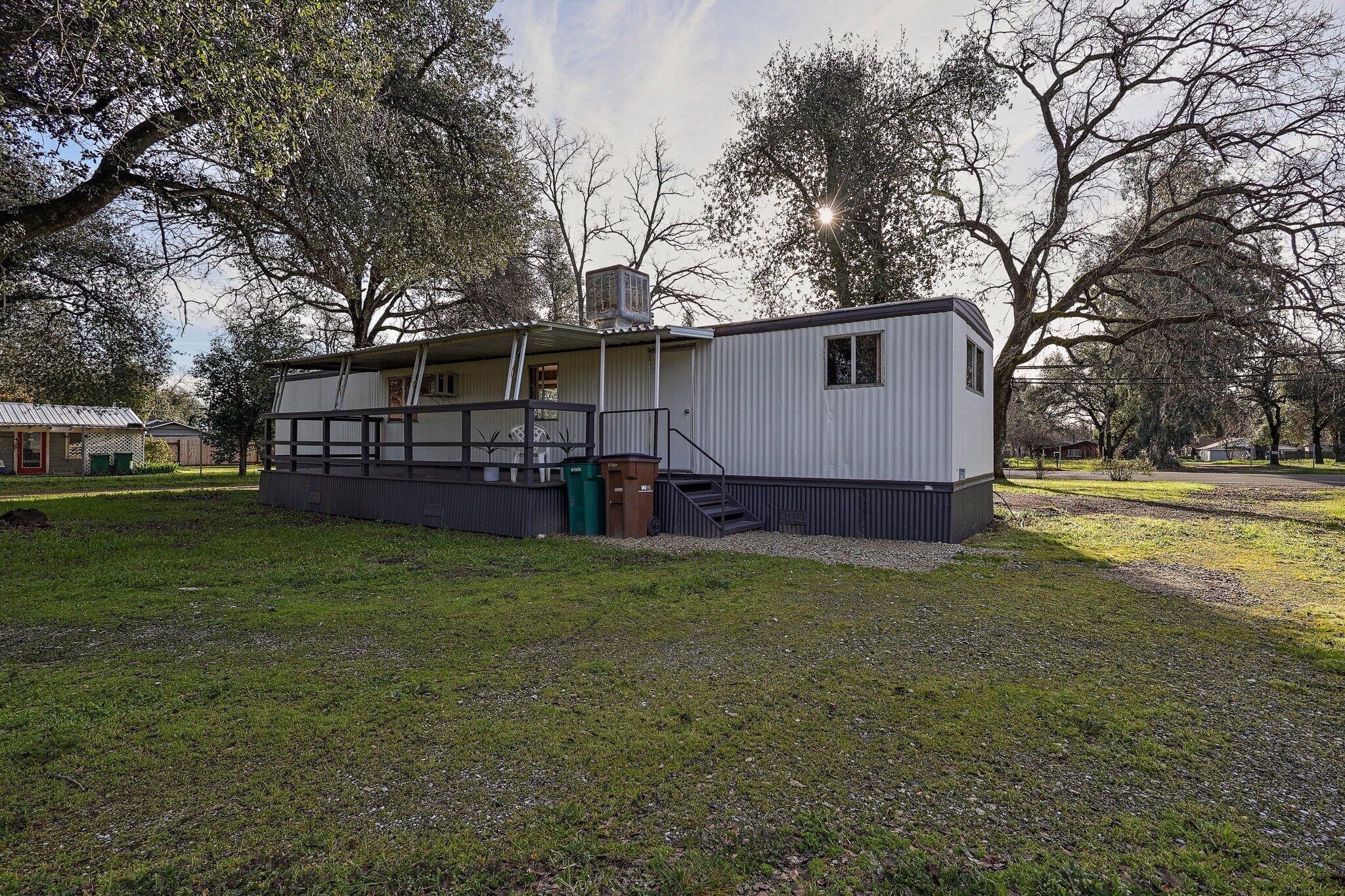a view of a house with a back yard