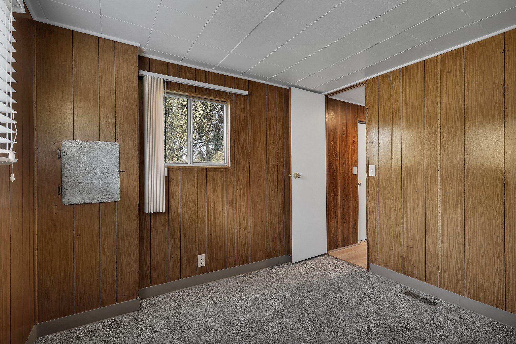 7680 Happy Valley Road Anderson, CA 96007 - Photo 17 of 39 a view of an empty room with wooden floor and closet area