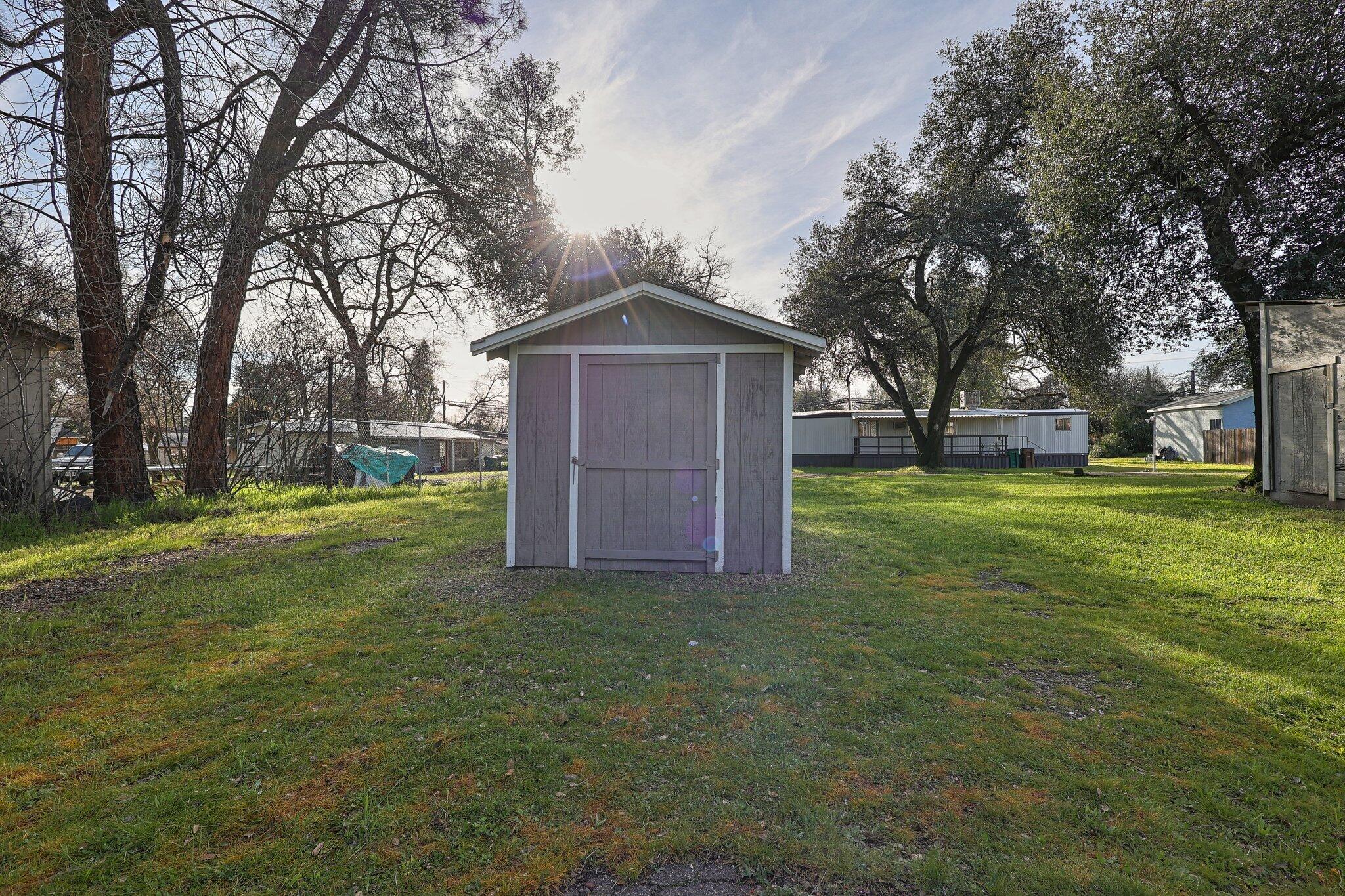 7680 Happy Valley Road Anderson, CA 96007 - Photo 27 of 39 a view of a big yard with large trees
