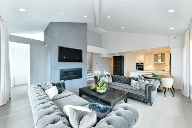 a living room with fireplace furniture and a fireplace