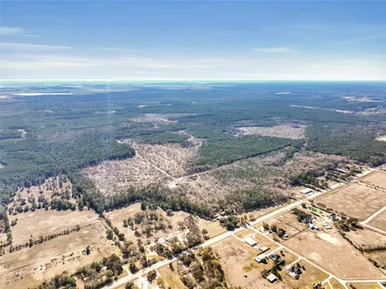 a view of dirt road with a building