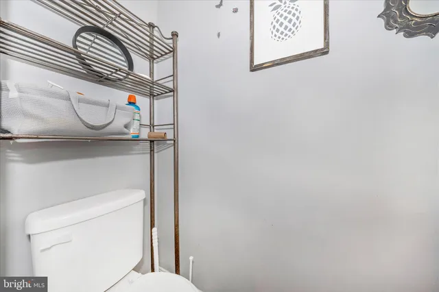 a bathroom with a toilet and a sink