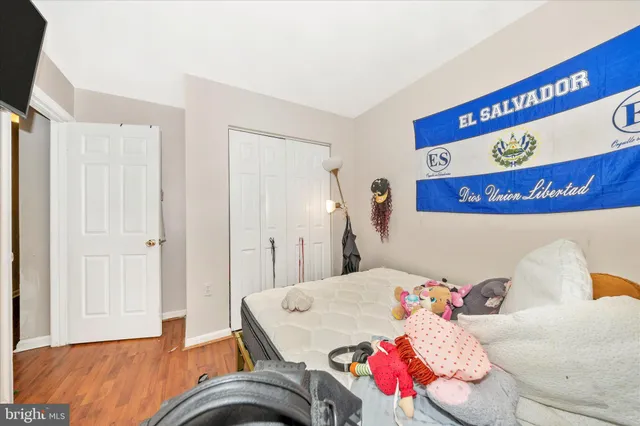 a bedroom with a bed and a table